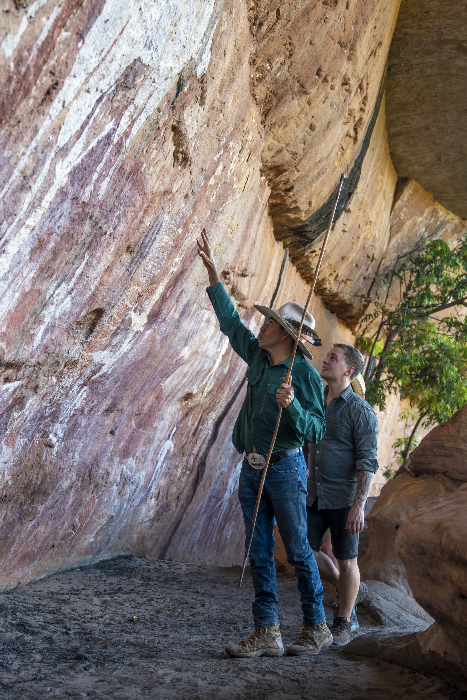 Johnny showing guests the ancient rock art at Magnificant Gallery Jarramali Rock Art Tours Johnny showing guests the ancient rock art at Magnificant Gallery Jarramali Rock Art Tours