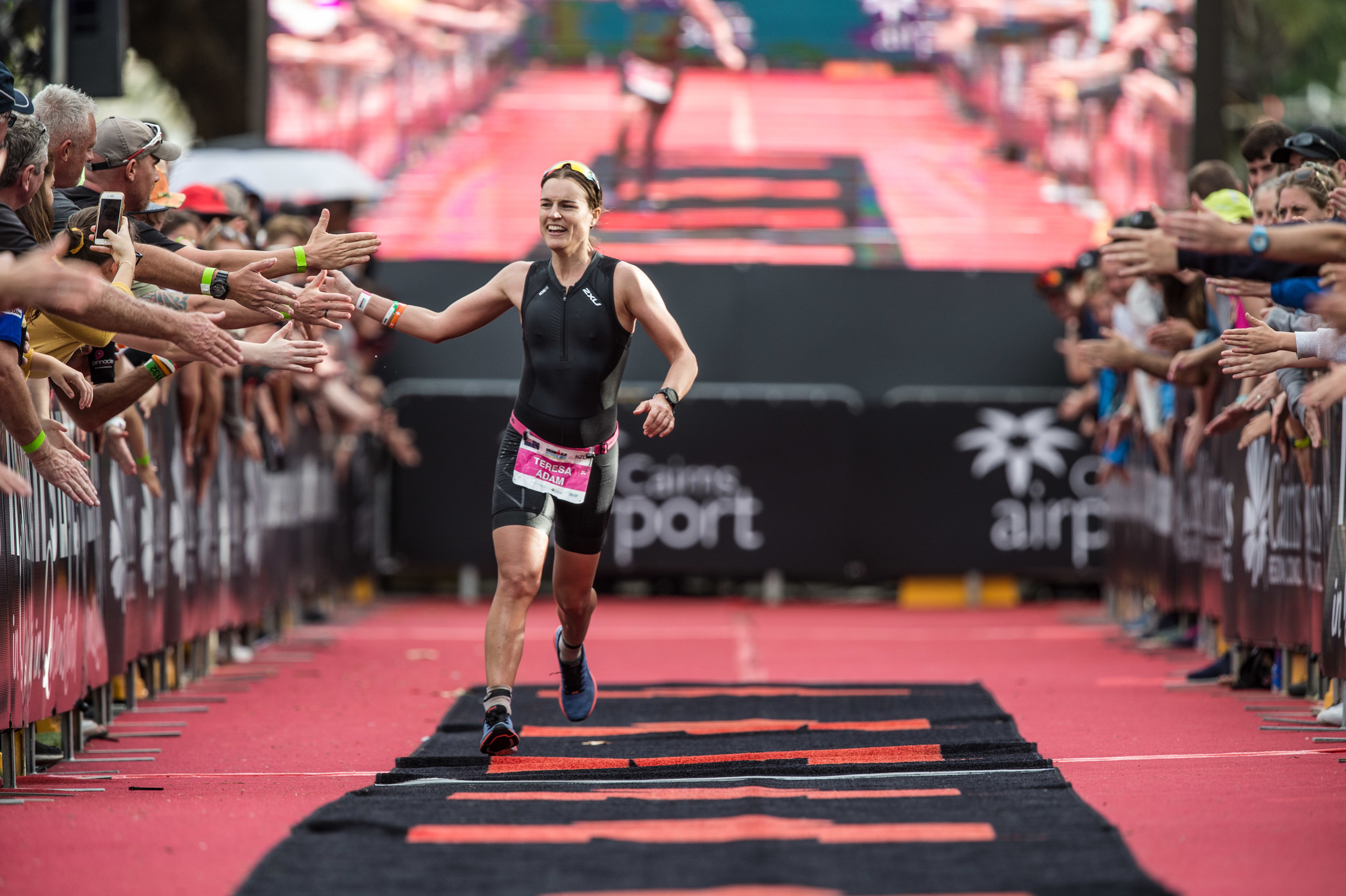Athlete running near crowds Cairns IRONMAN | Cairns IRONMAN triathlon Athlete running near crowds Cairns IRONMAN | Cairns IRONMAN triathlon