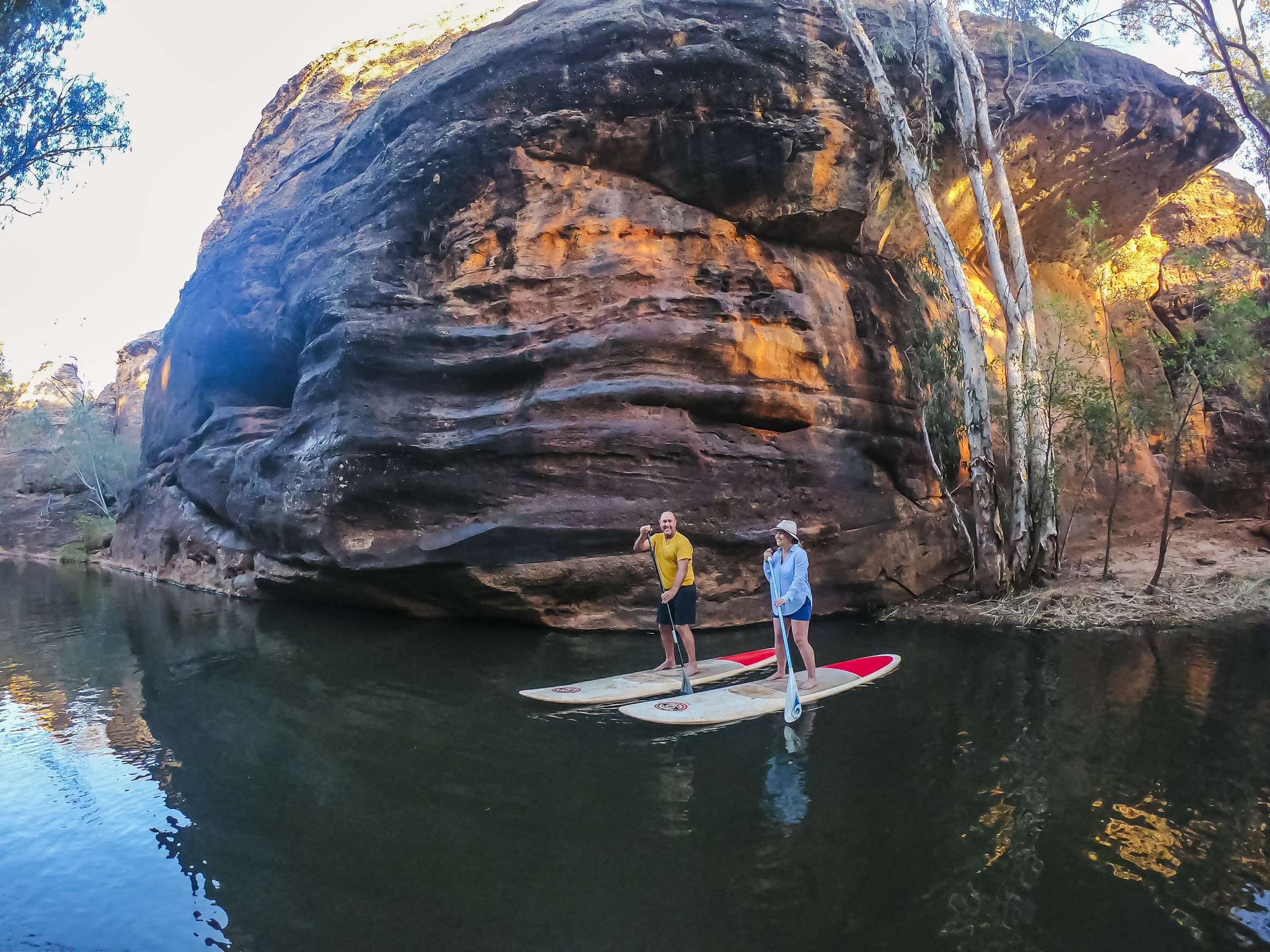 Couple Stand Up Paddle Boarding at Cobbold Gorge