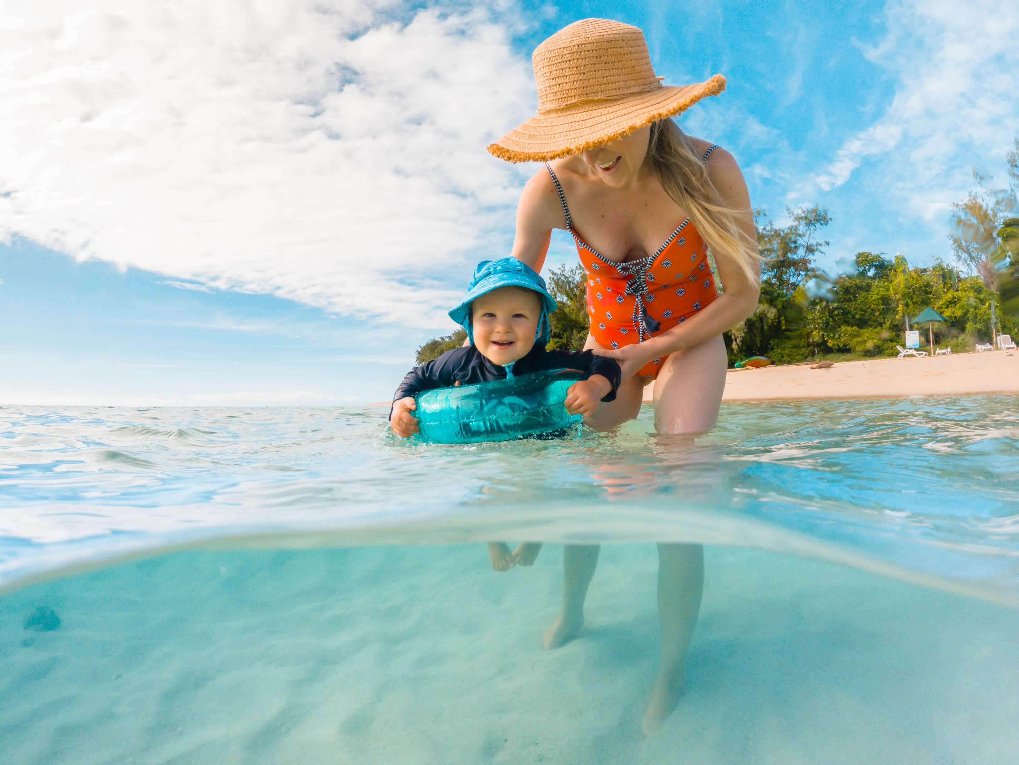 Mother and child enjoying the beach at Green Island | How to plan your first holiday with a baby Queensland Mother and child enjoying the beach at Green Island | How to plan your first holiday with a baby Queensland
