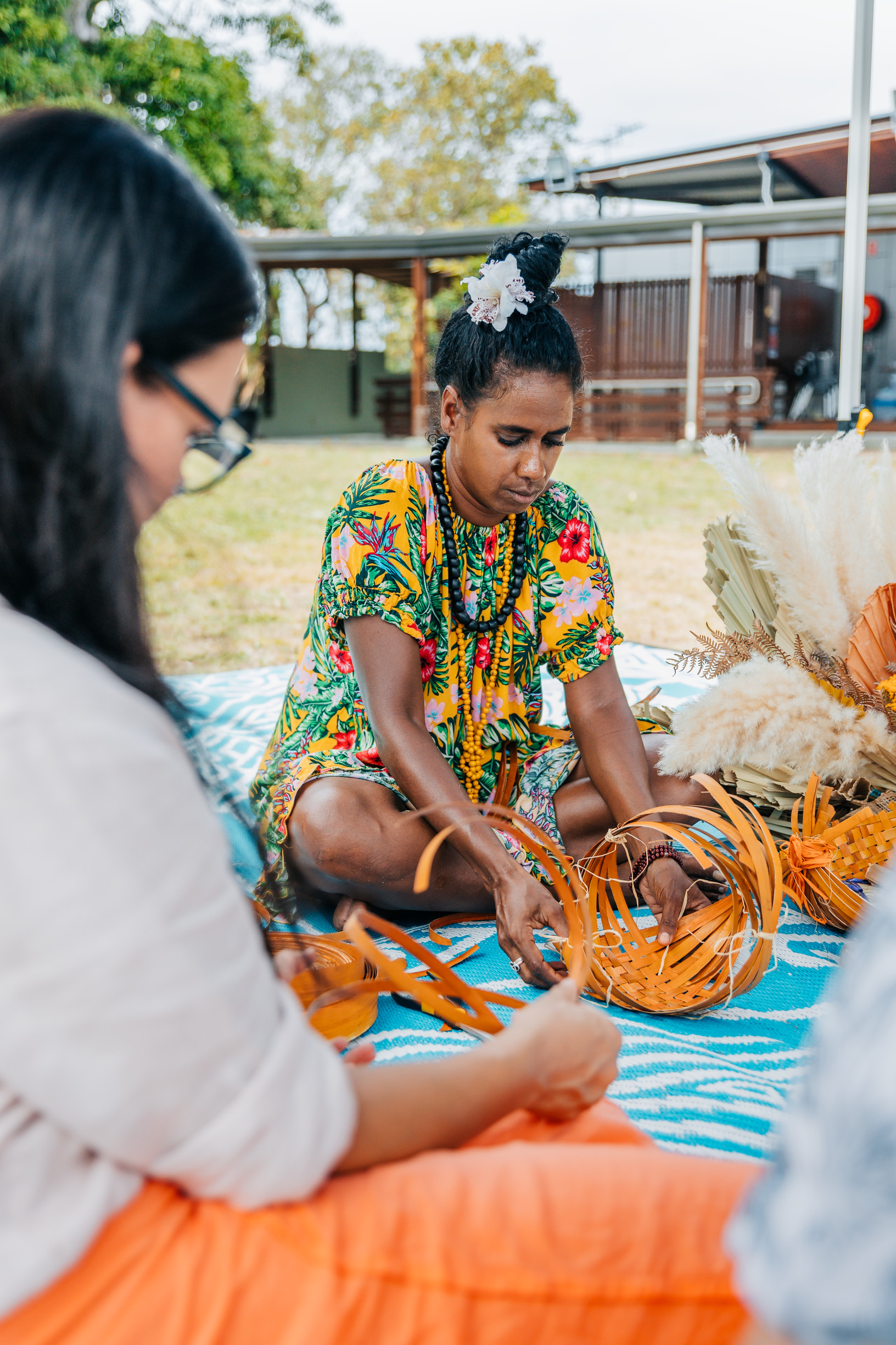 Local artist shows a couple how to basket weave at Gab Titui Cultural Centre, Thursday Island Local artist shows a couple how to basket weave at Gab Titui Cultural Centre, Thursday Island
