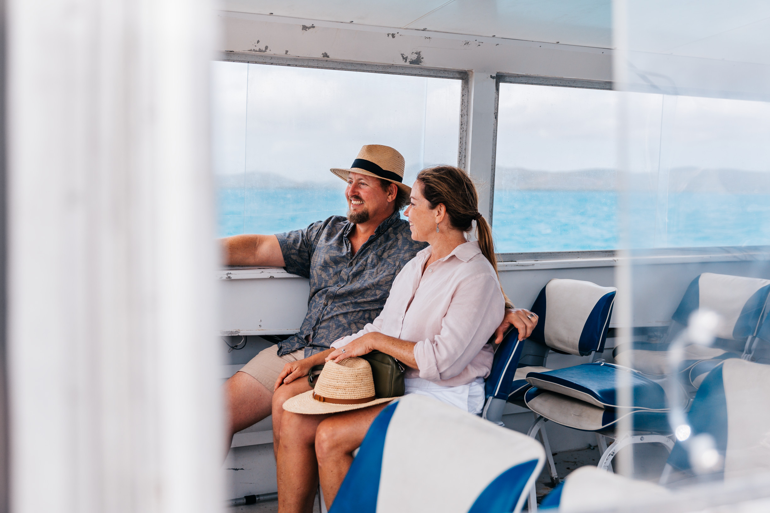 Couple on a ferry transferring between islands with Torres Strait Tours Couple on a ferry transferring between islands with Torres Strait Tours