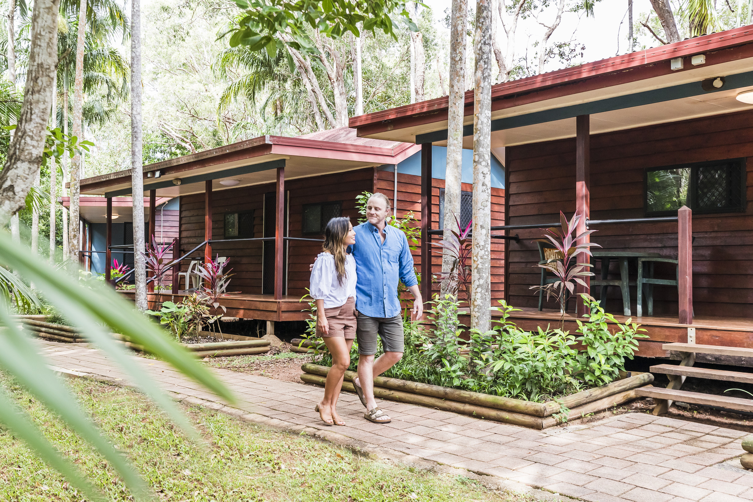 Couple walking past accommodation at Cape York Peninsula Lodge Couple walking past accommodation at Cape York Peninsula Lodge