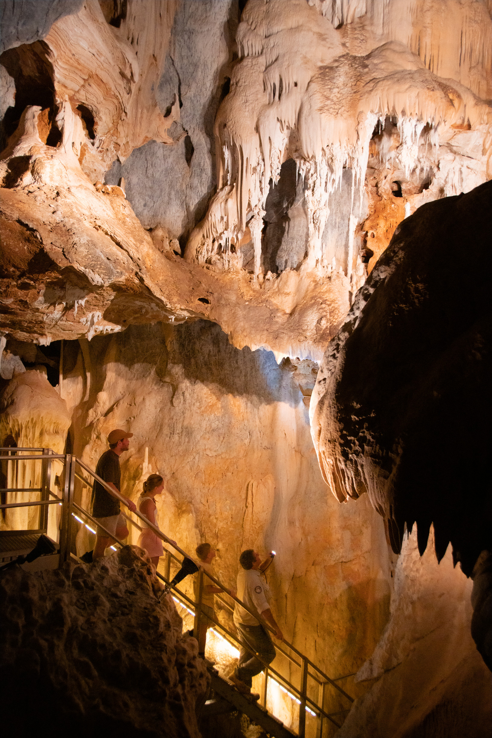 Family exploring a cave on a Ranger-guided Trezkinn Cave Tour, Chillagoe Caves | Lesser known Queensland national parks Family exploring a cave on a Ranger-guided Trezkinn Cave Tour, Chillagoe Caves | Lesser known Queensland national parks
