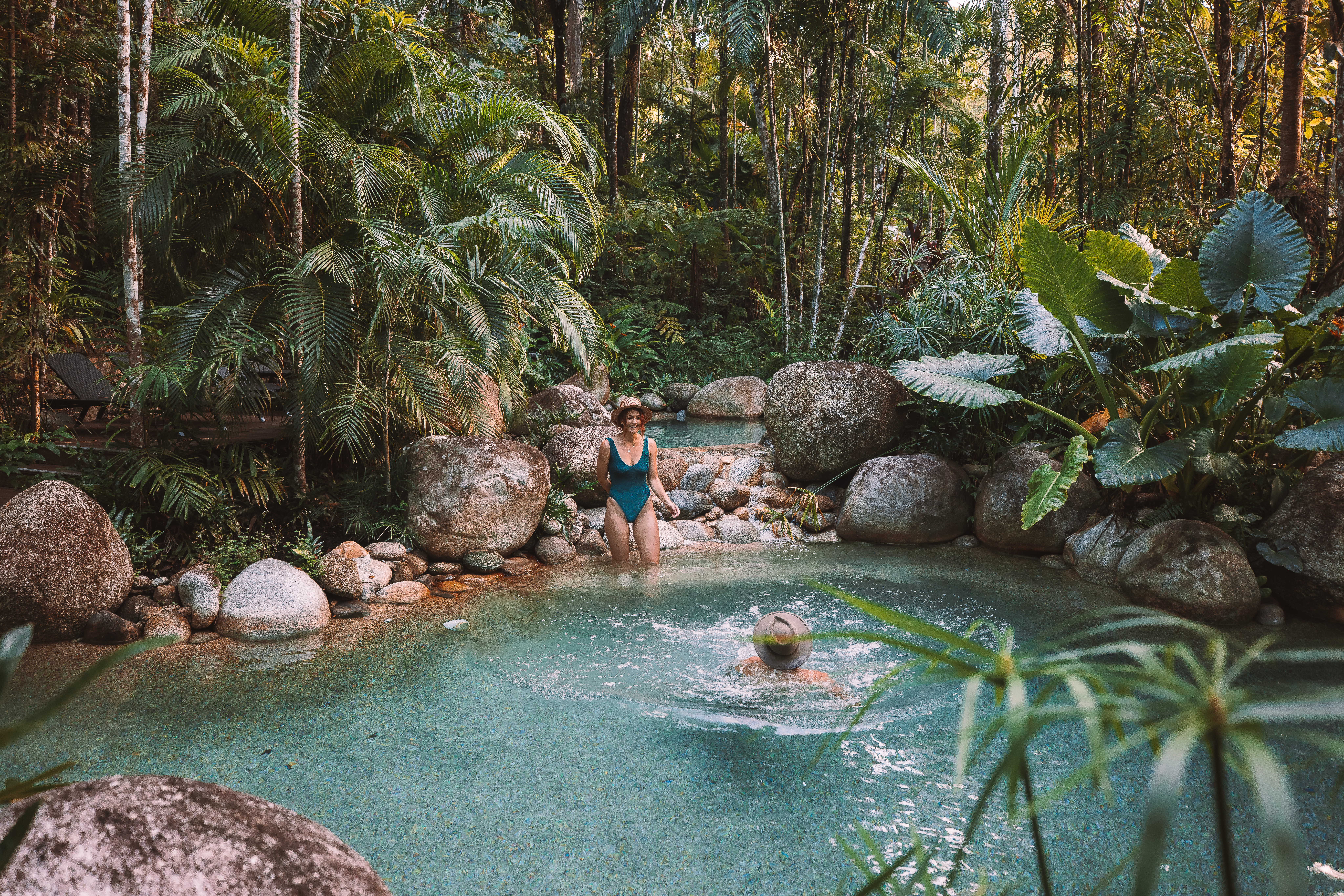 Couple swimming in the pool at Silky Oaks Lodge in the Daintree Rainforest Couple swimming in the pool at Silky Oaks Lodge in the Daintree Rainforest
