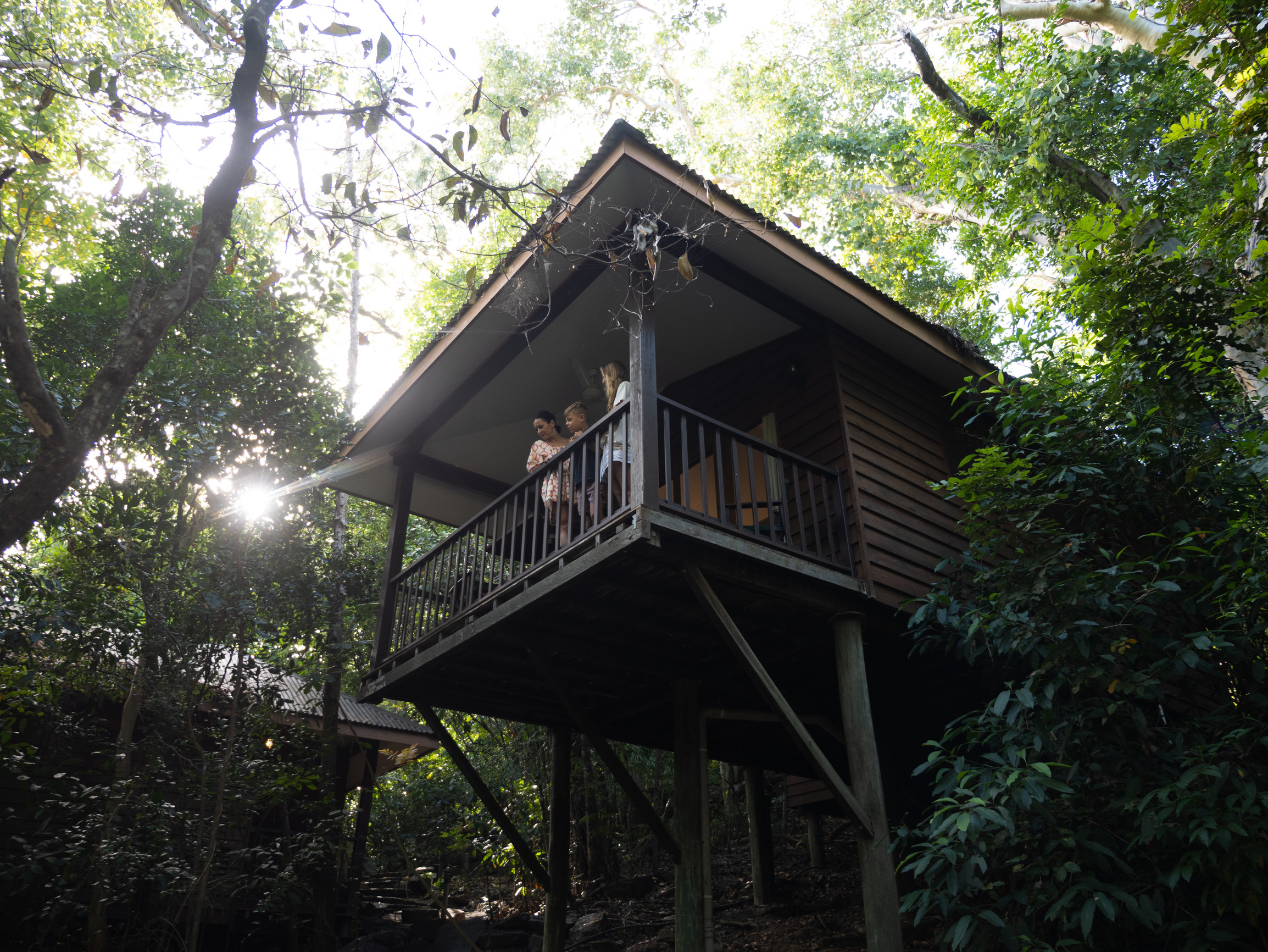 Family looking at the views from the balcony of their Jungle Walk Bungalow, Thala Beach Nature Reserve Family looking at the views from the balcony of their Jungle Walk Bungalow, Thala Beach Nature Reserve