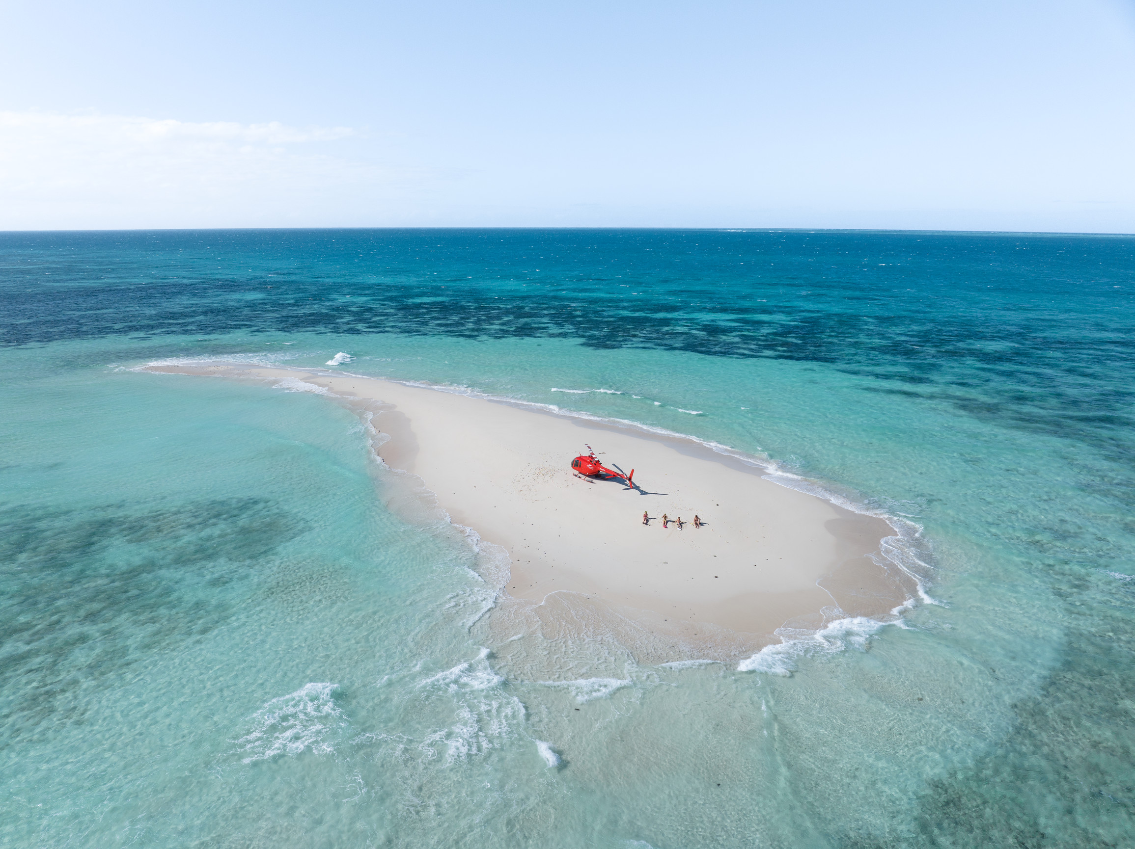 guests relaxing on the sand of private Vlasoff Cay with Nautilus Aviation