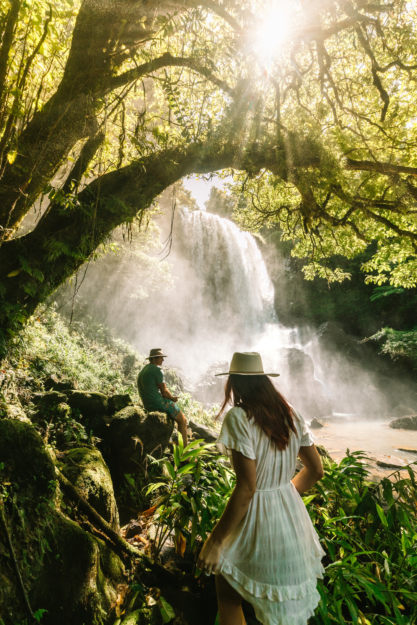 Couple enjoying Zillie Falls in Atherton Tablelands, near Cairns Couple enjoying Zillie Falls in Atherton Tablelands, near Cairns
