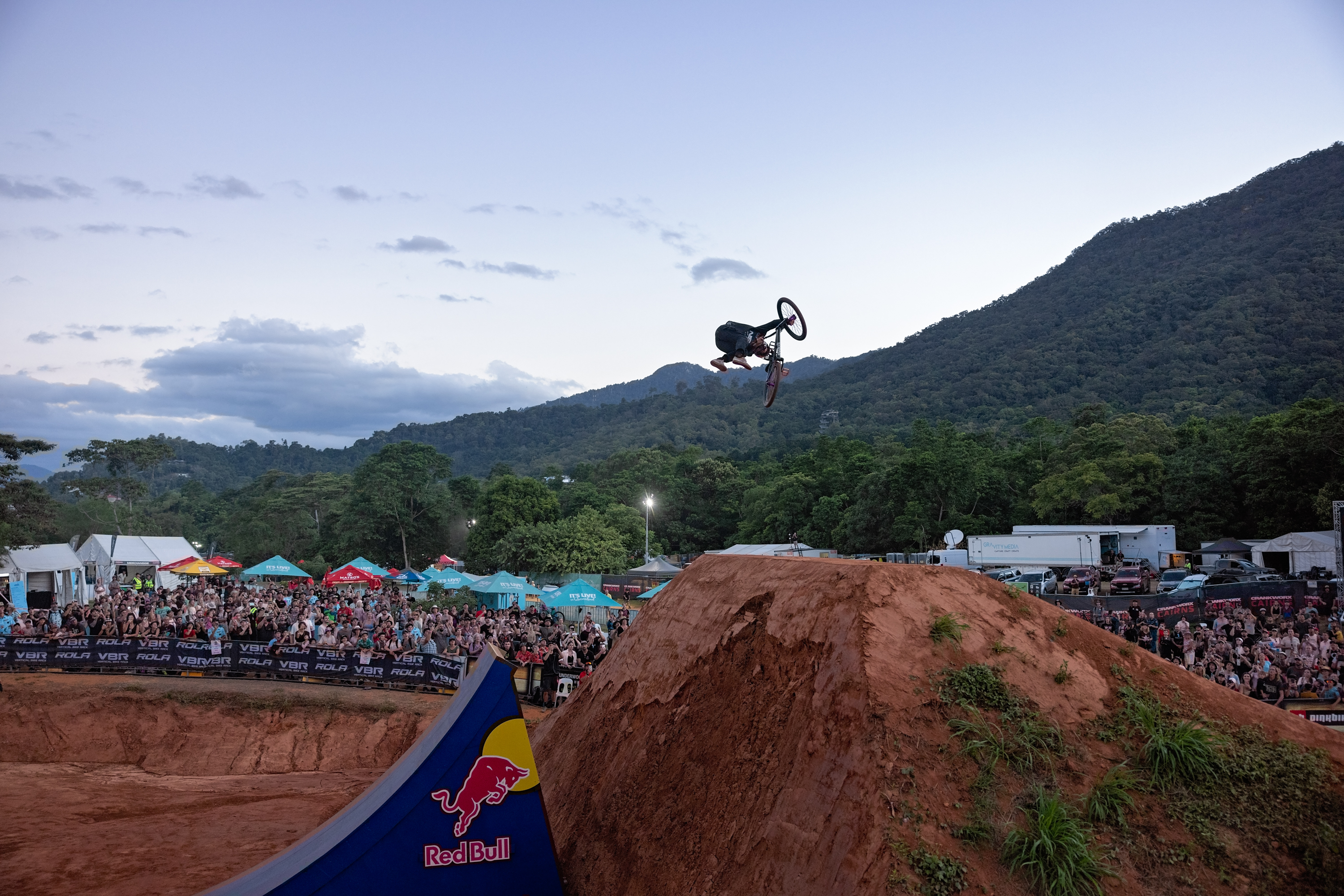Extreme BMX-er performs huge jump in front of spectators at Crankworx Cairns