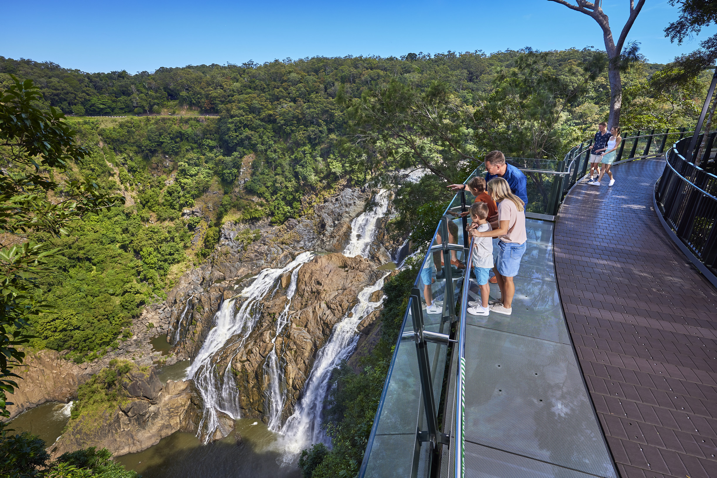 Family at The Edge lookout, looking out over the Barron Falls, Skyrail Rainforest Cableway | Cairns with kids - 4 day itinerary Family at The Edge lookout, looking out over the Barron Falls, Skyrail Rainforest Cableway | Cairns with kids - 4 day itinerary