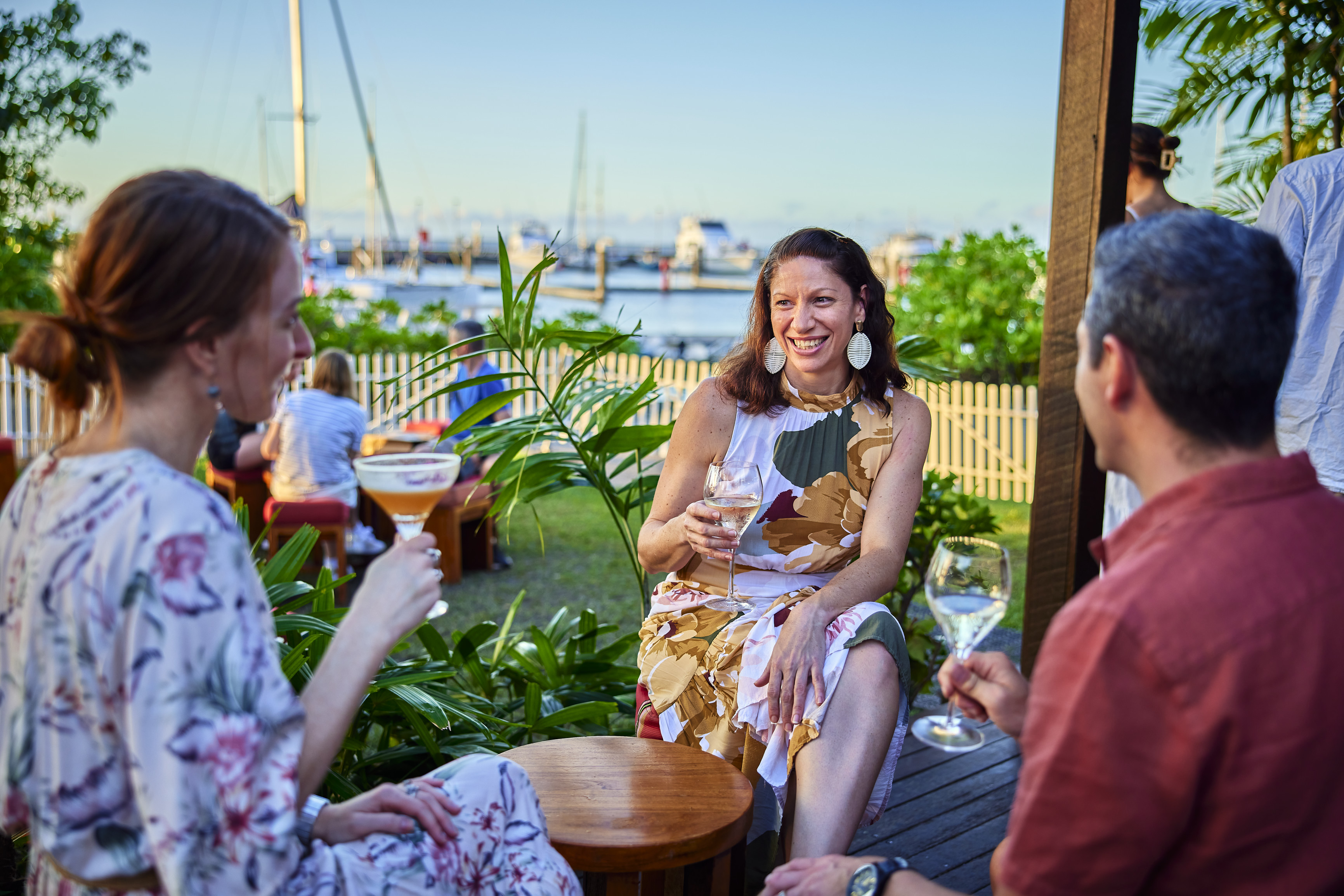 Group of friends enjoying a drink in the outside area of the Salt House with views into the harbour Group of friends enjoying a drink in the outside area of the Salt House with views into the harbour