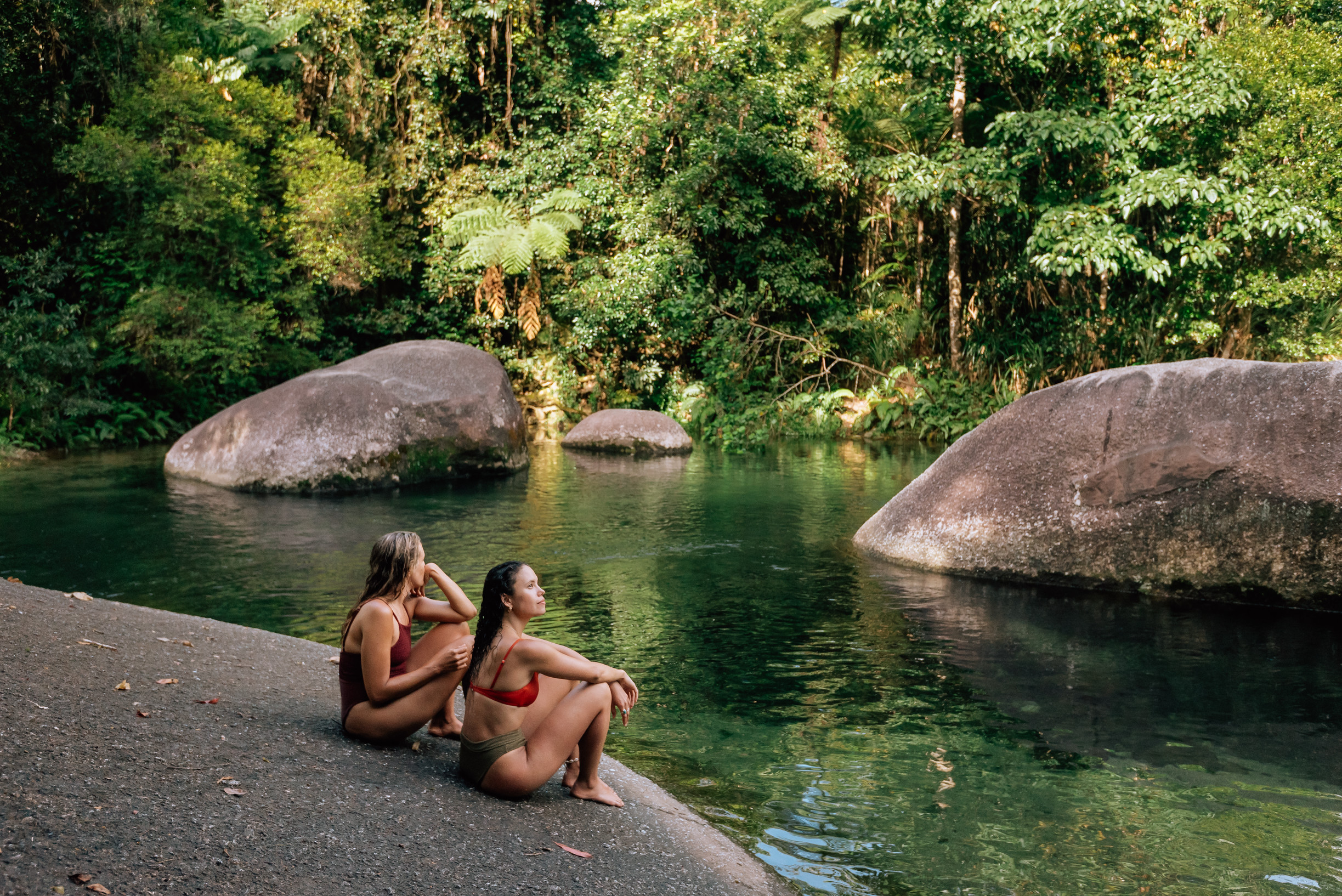 Two ladies sitting on the rocks at Babinda Boulders Two ladies sitting on the rocks at Babinda Boulders