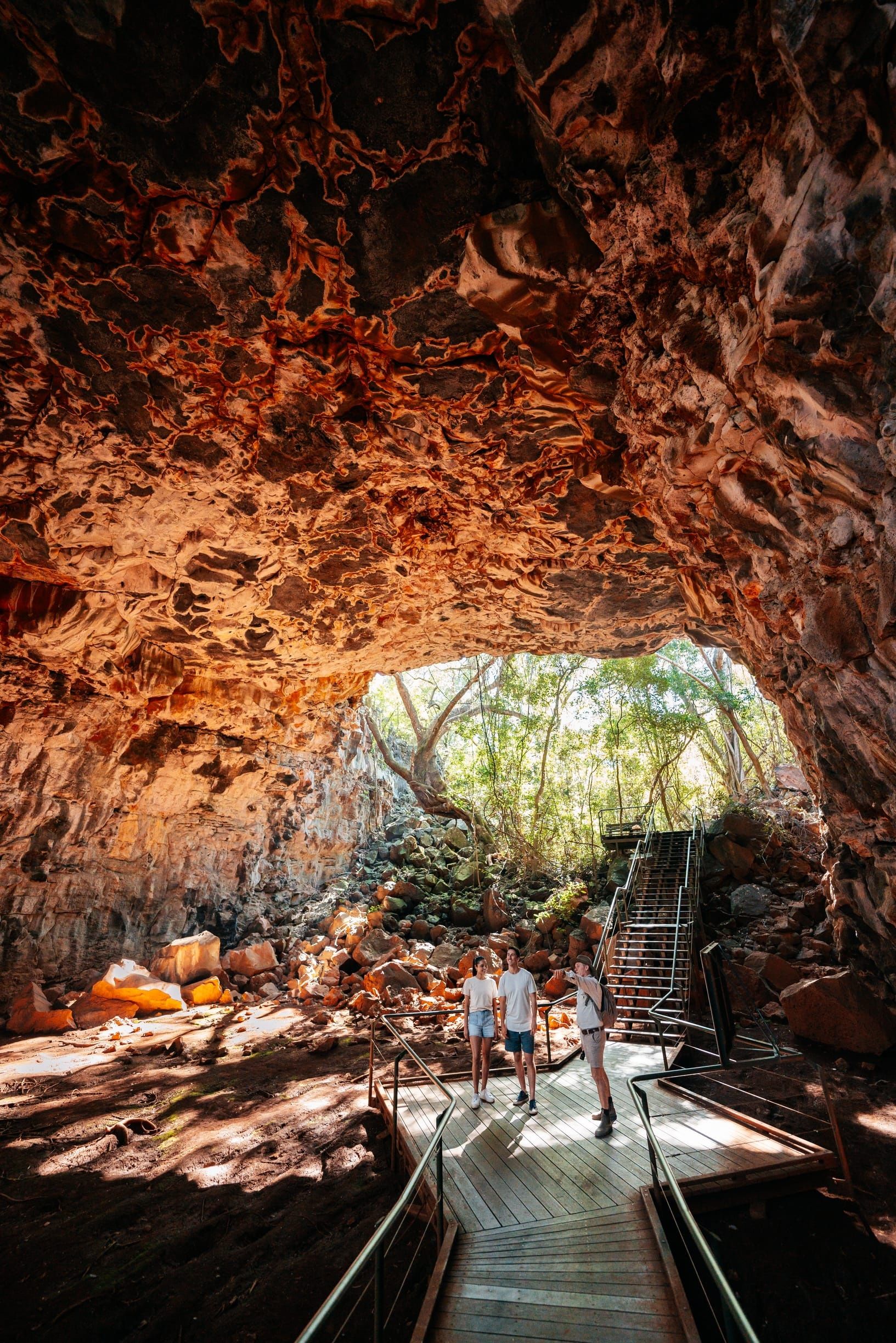 Couple on guided tour through lava tubes at Undara Volcanic National Park