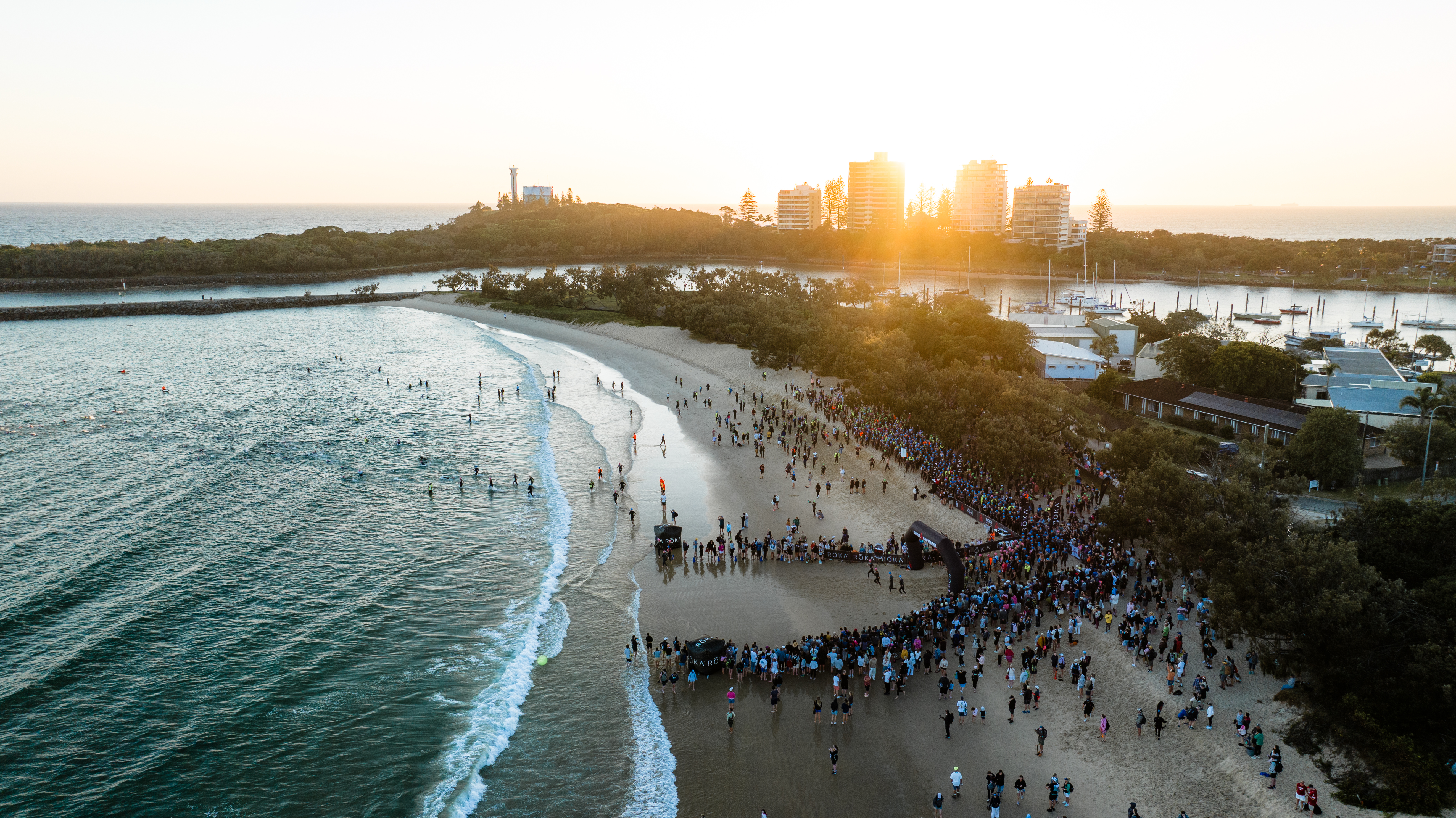 Cyclists compete the road cycling section of Ironman 70.3 beside Mooloolaba beach