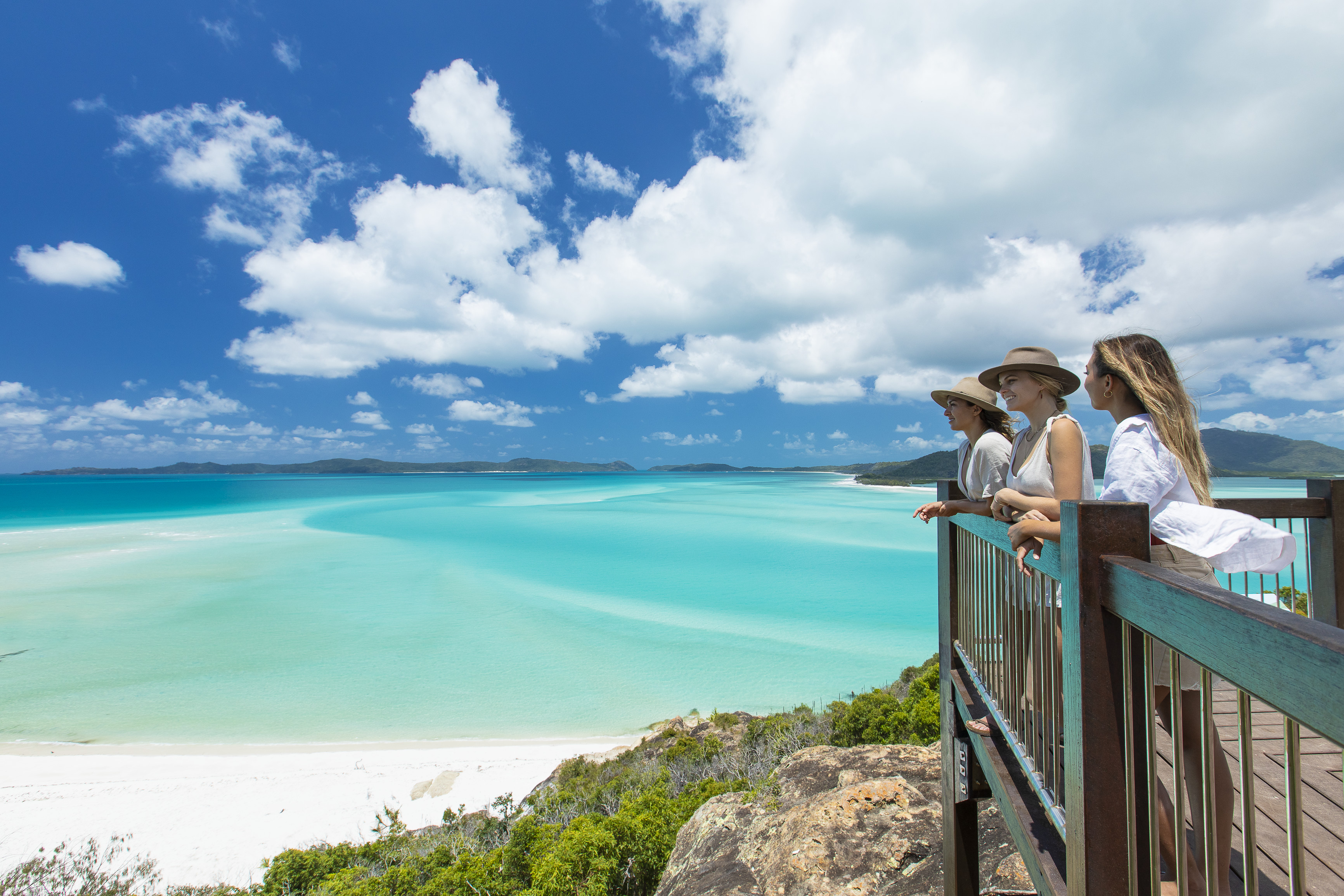 Ladies looking out over Whitehaven Beach from Hill Inlet Lookout