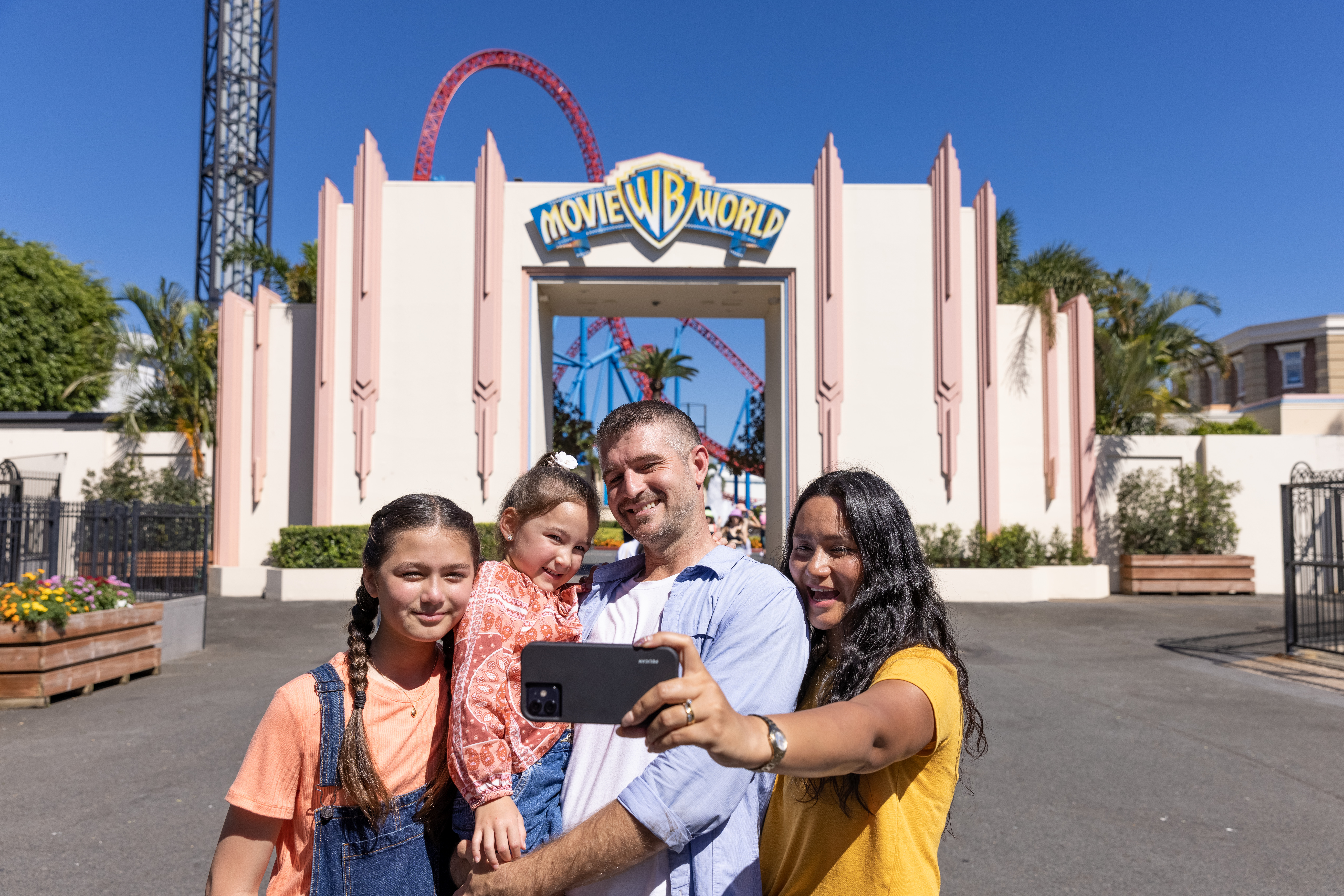 Family at the entrance of the park Family at the entrance of the park