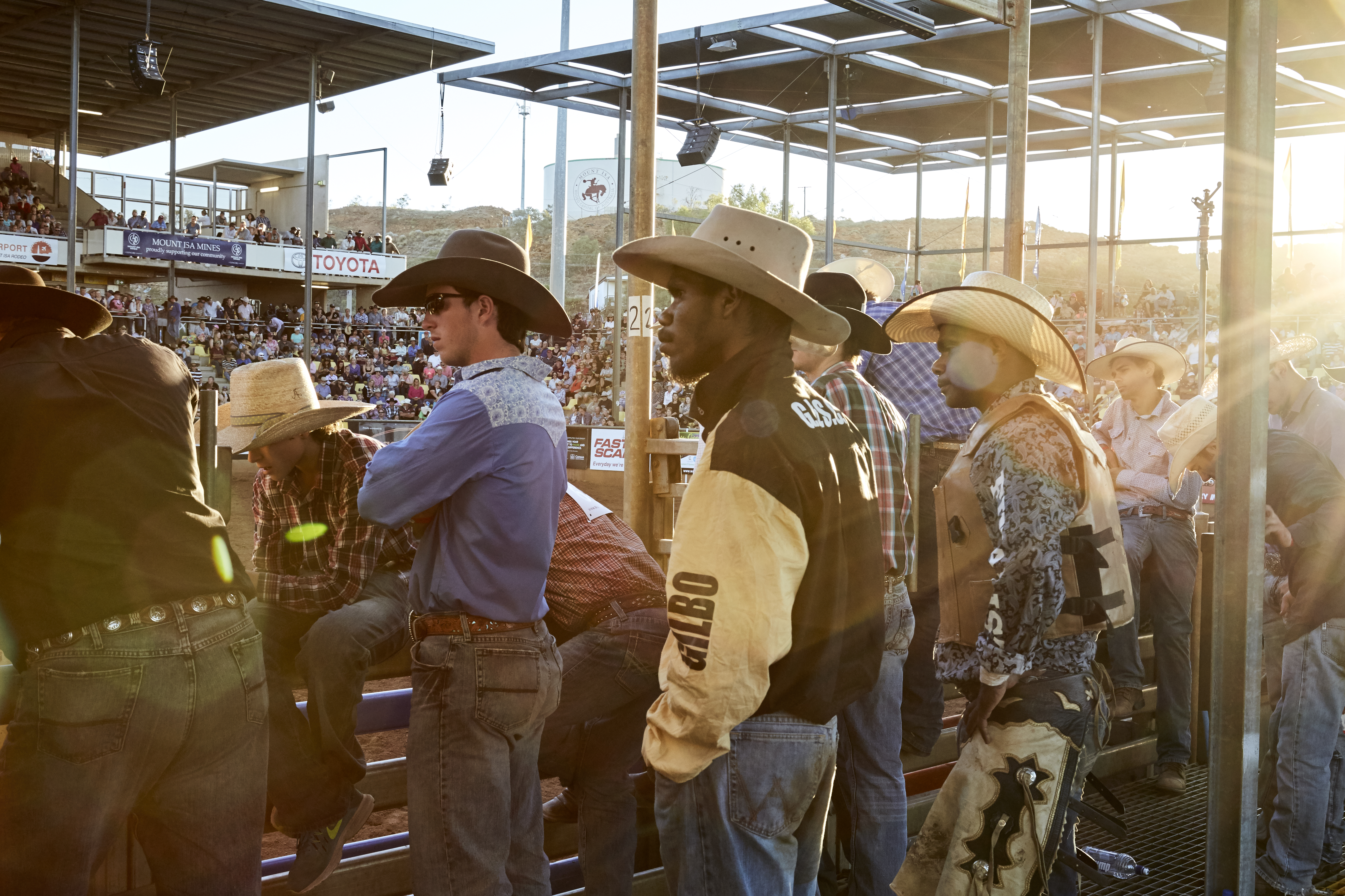 Rodeo competitors wearing cowboy hats preparing for the Mount Isa Rodeo.