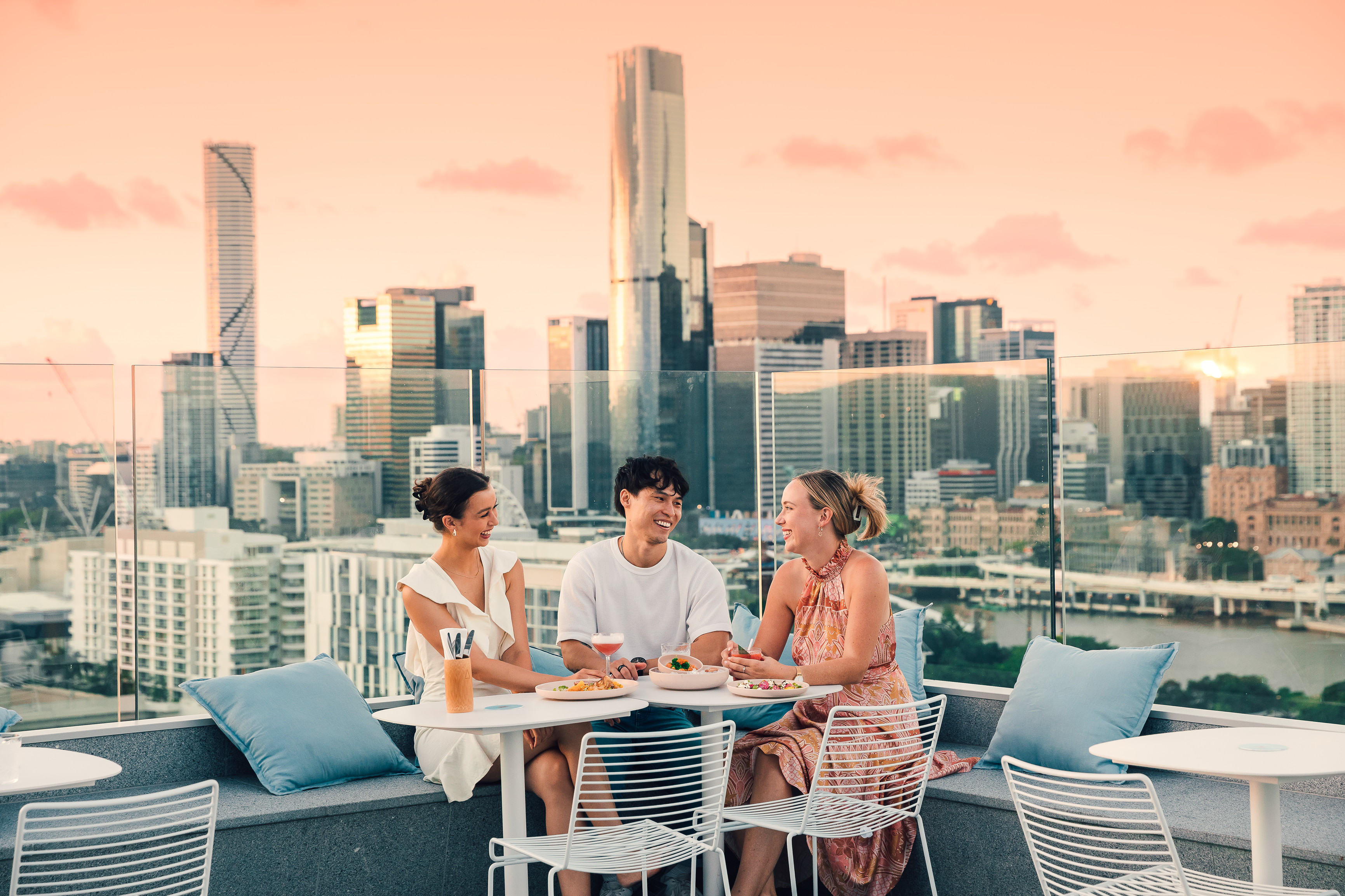 Group of friends enjoying a drink at Lina Rooftop | Brisbane backpackers guide