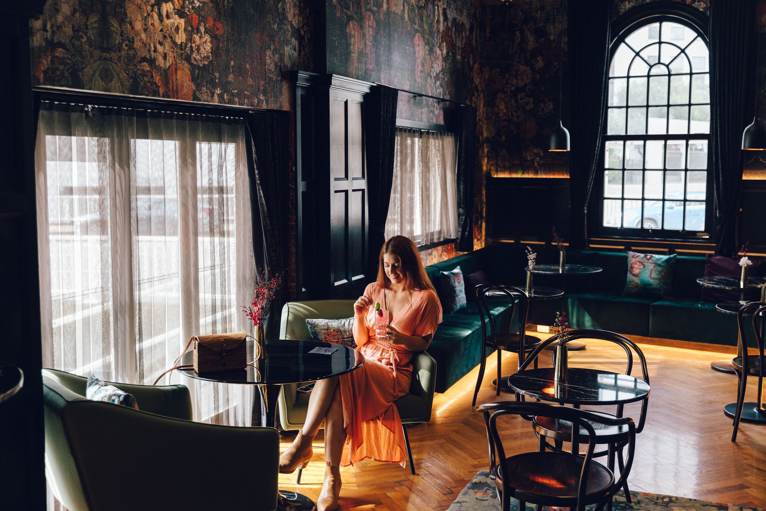 Lady enjoying a drink at the bar in The Inchcolm 